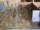 a lot of empty glass bottles on the table
