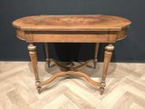 a wooden table with two legs and a wooden top on a wooden floor