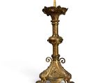an antique brass candle holder on a white background with a white background