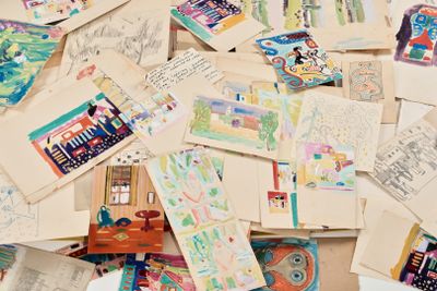 a pile of old postcards on a table