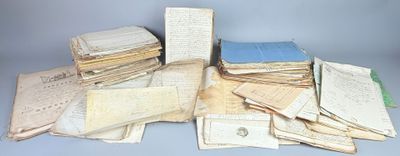 a pile of old papers on a table