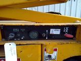 a close up of a yellow crane with a tag on it ' s side