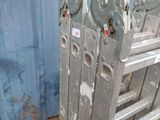 a metal rack with a bunch of wheels on top of it