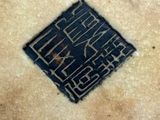 an image of a close up of a pie crust with a logo on it