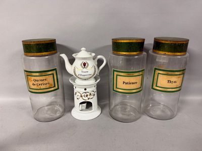 three glass jars with teapots and a teapot on top of them
