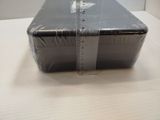a plastic box with a measuring tape on top of it
