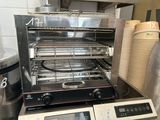 a toaster oven sitting on top of a counter next to a blender