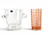 two vases sitting next to each other on a white surface