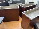 four wooden planters sitting on the floor in a room