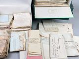 a lot of old papers that are sitting on a table