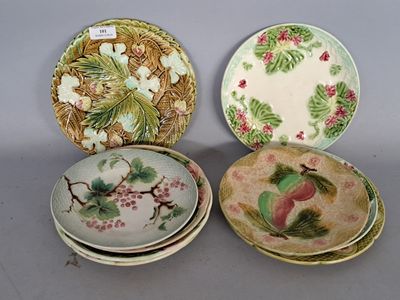 three plates with different designs on them sitting next to each other