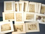a lot of old photographs on the table together