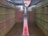 an image of a red bike in a narrow tunnel