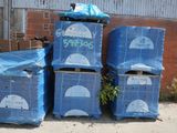many boxes stacked on top of each other on the street