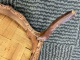 a close up of a tennis racket on a carpet