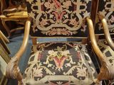 pair of carved wood chairs with black and gold upholstered upholstered upholstered upholstered upholstered upholstered upholstered uphol