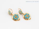 pair of turquoise and gold earrings