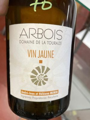 a bottle of wine that is being held by a person