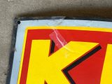 a close up of a sign with a k on it