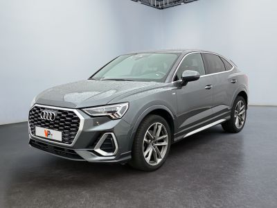 a grey audi qx parked in a showroom