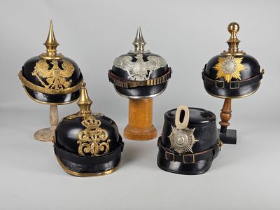 three helmets and a helmet on a wooden stand on a white surface