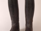 pair of brown leather riding boots on a white background