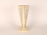 a white vase that is sitting on a table