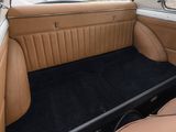 the interior of a car with tan leather seats and black carpet