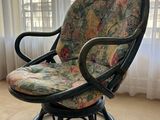 a chair that is sitting in front of a window