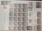 a picture of a sheet of stamps with pictures of people on them