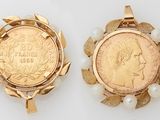 two pieces of gold and pearl jewelry with a coin in the middle