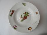 a white plate with a picture of vegetables on it