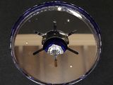 a picture of a circular mirror with a blue light in it