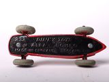 a toy skateboard with wheels on a white surface
