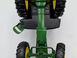 a toy tractor that is attached to a wall