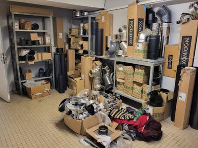 a room filled with lots of boxes and pots and pans