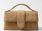 an image of a women ' s purse with a crocodile skin pattern on the front