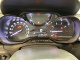 a close up of a car dashboard with a speedometer and gauges