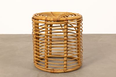 an image of a round rattan stool with a wooden base