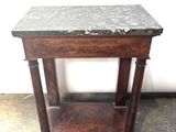 a small table with a marble top on it