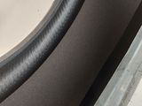 a close up of a black chair with a black seat