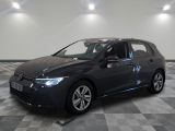 the volkswagen golf is parked in a large room with a checkered floor