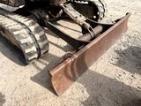 a bulldozer that is sitting in the dirt
