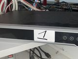an image of a dvd player sitting on top of a shelf