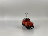 an image of a small red train on a white surface