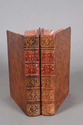 an old book is open to show the inside of it