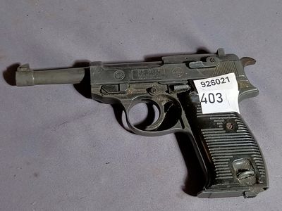 a gun with a price tag on it sitting on a table