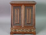 an image of a wooden cabinet with intricate carvings on the doors