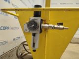 a close up of a pressure gauge attached to a yellow pole