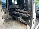 a van that has a bunch of pipes in the back of it